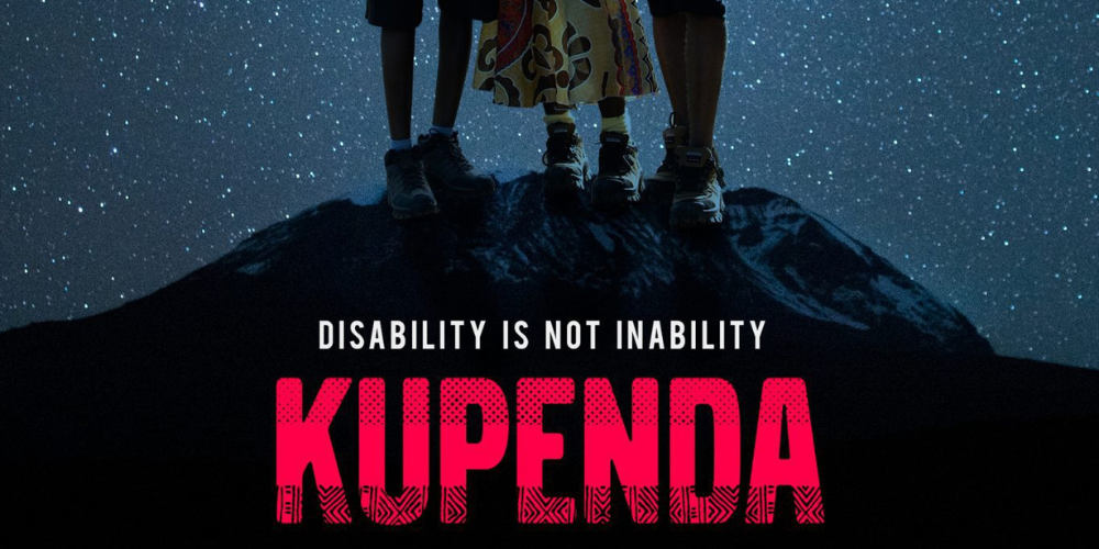 Kupenda movie poster with "Disability is not inability" and three people standing on top of a mountain with a starry sky