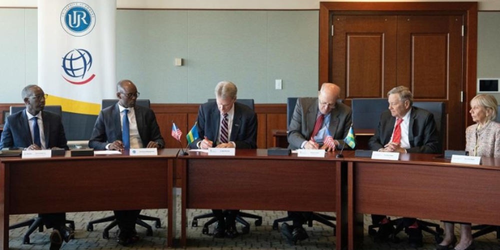 UMB President Dr. Bruce Jarrell signs an agreement with Operation Smile and the University of Rwanda