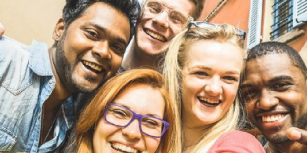 Five students pose for a selfie