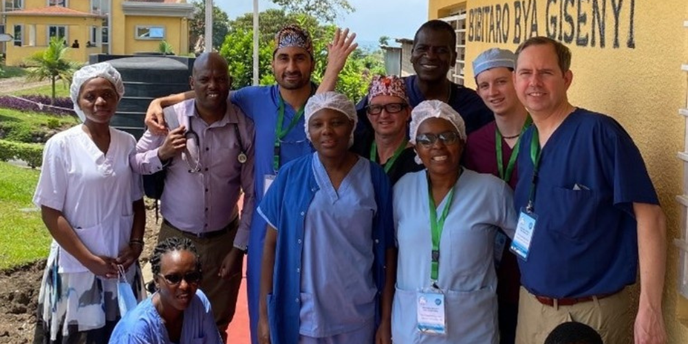 A group of doctors pose outside in Rwanda