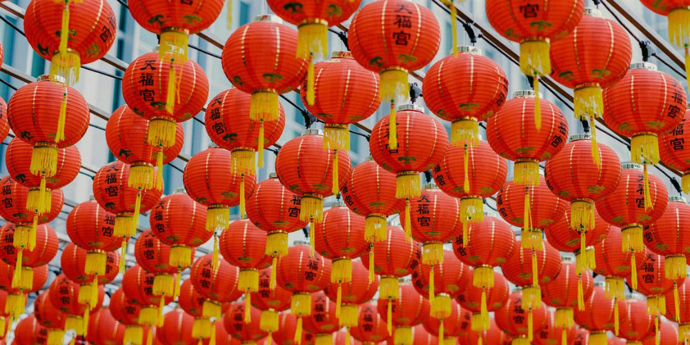 Red lanterns hanging across a street