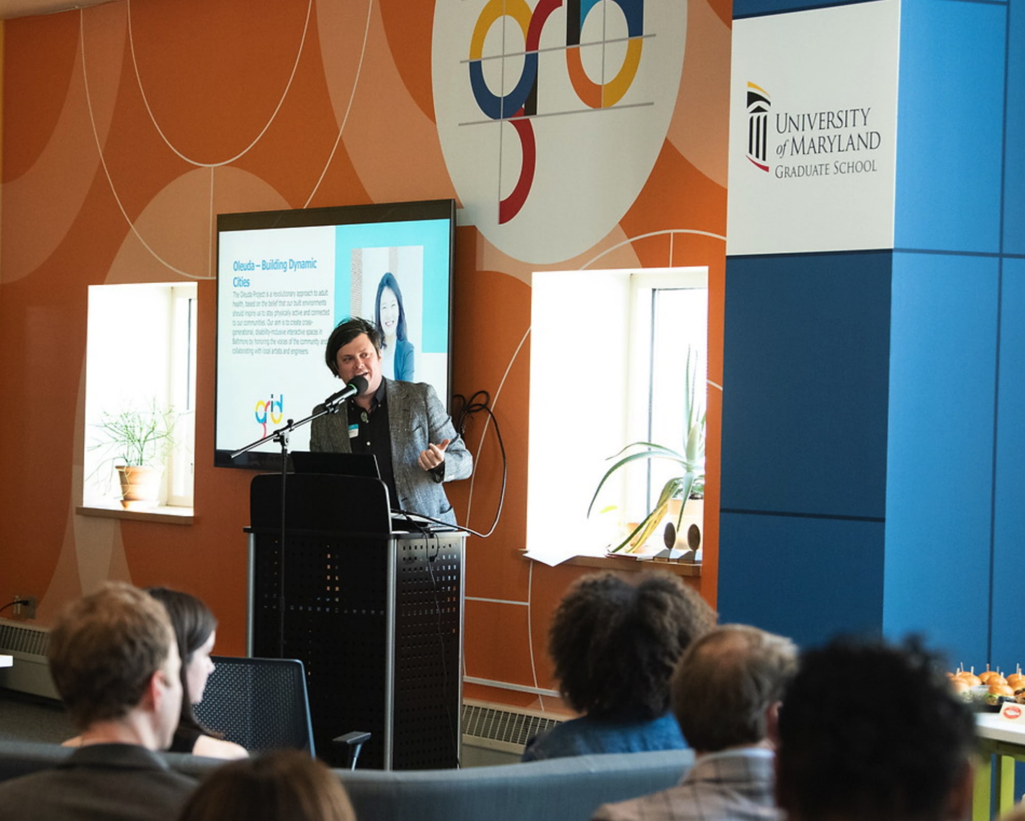 Graduate professional giving a presentation