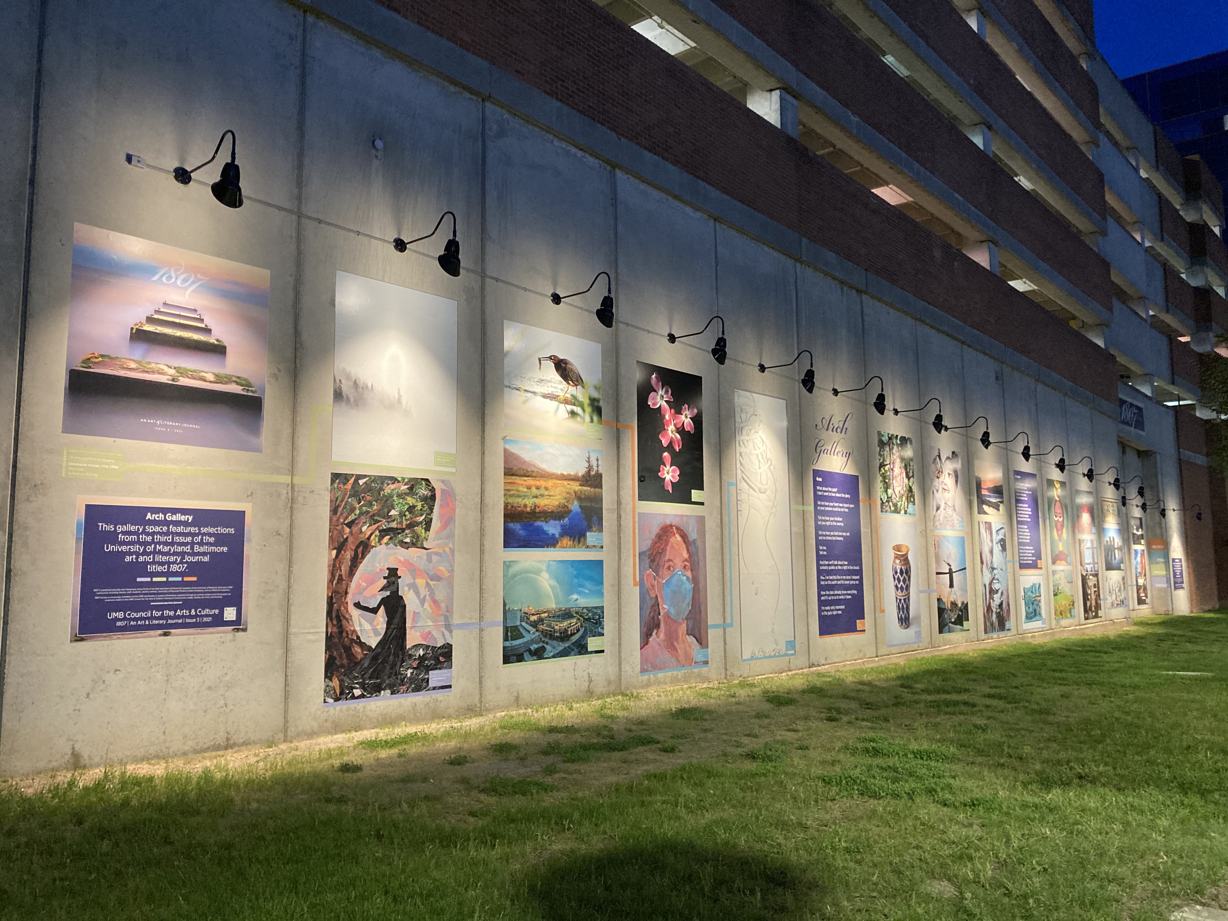 wall with art and lighting at night