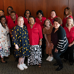 Women smiling while sitting