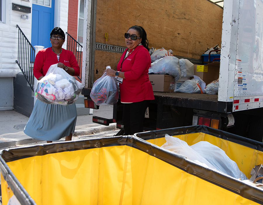 Eris Smith (left) and Saifa Poole deliver donations to Saint Paul's Place, delivered by UMBPACE
