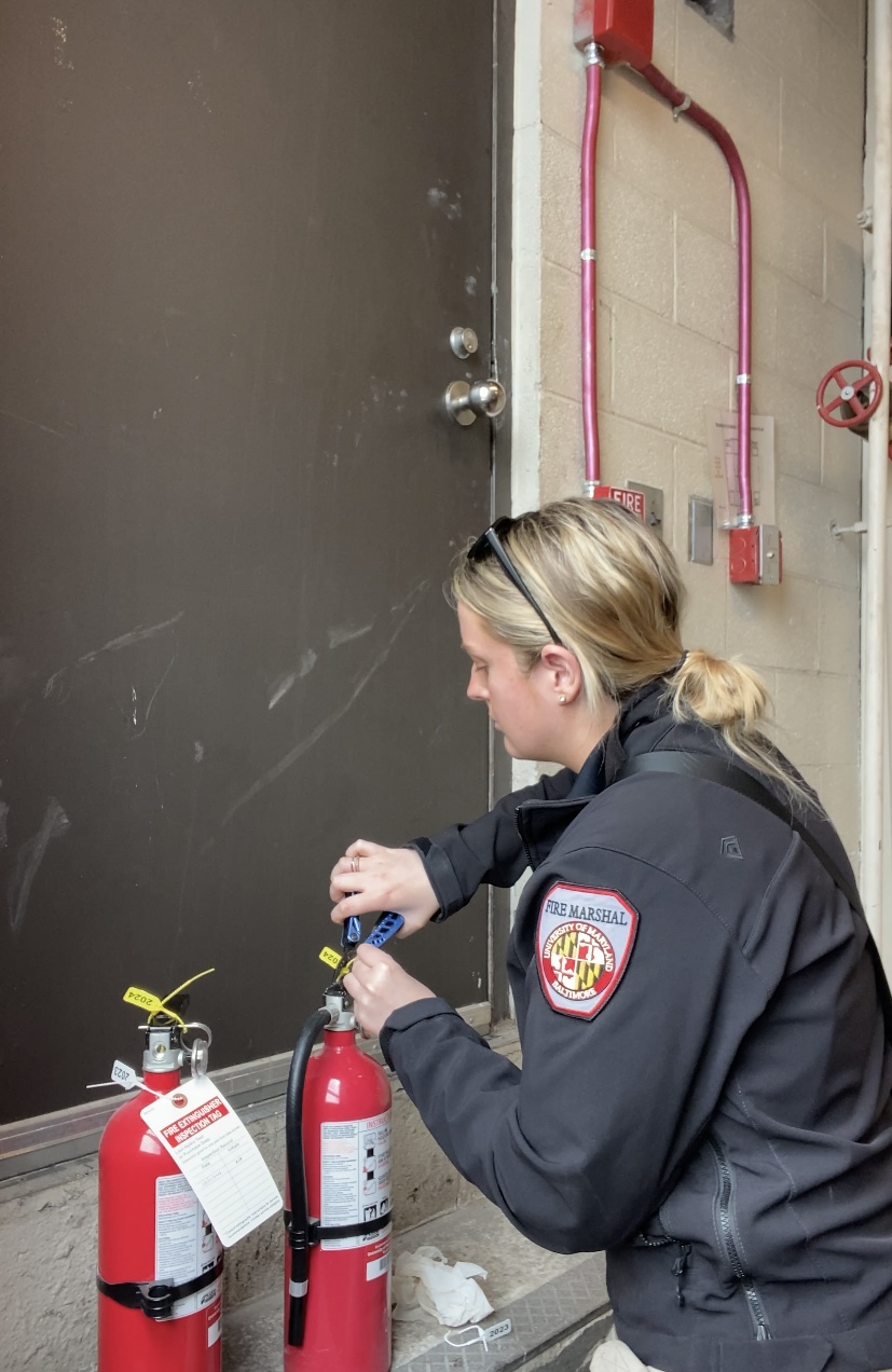 A person writing on a chalkboard