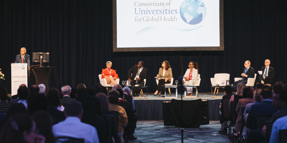 Speakers onstage at CUGH Conference,