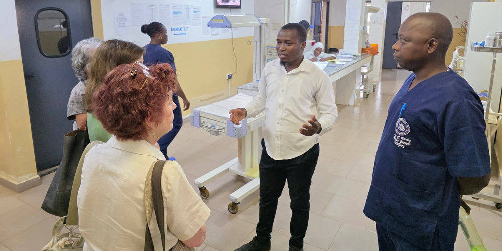 Dr. Melissa McDiarmid speaks with colleagues in The Gambia.