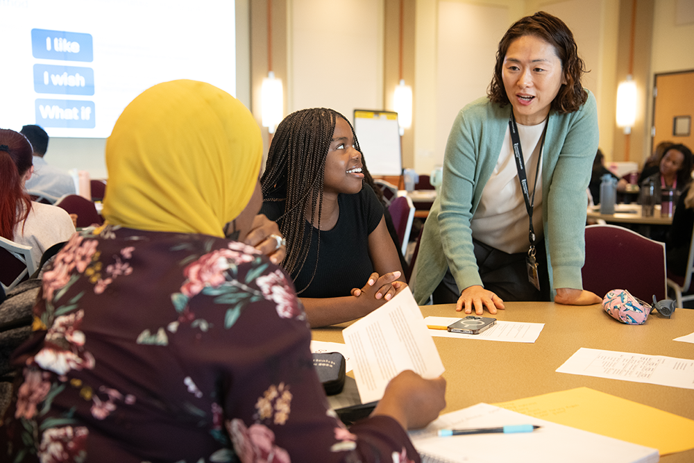 Three people at an orientation