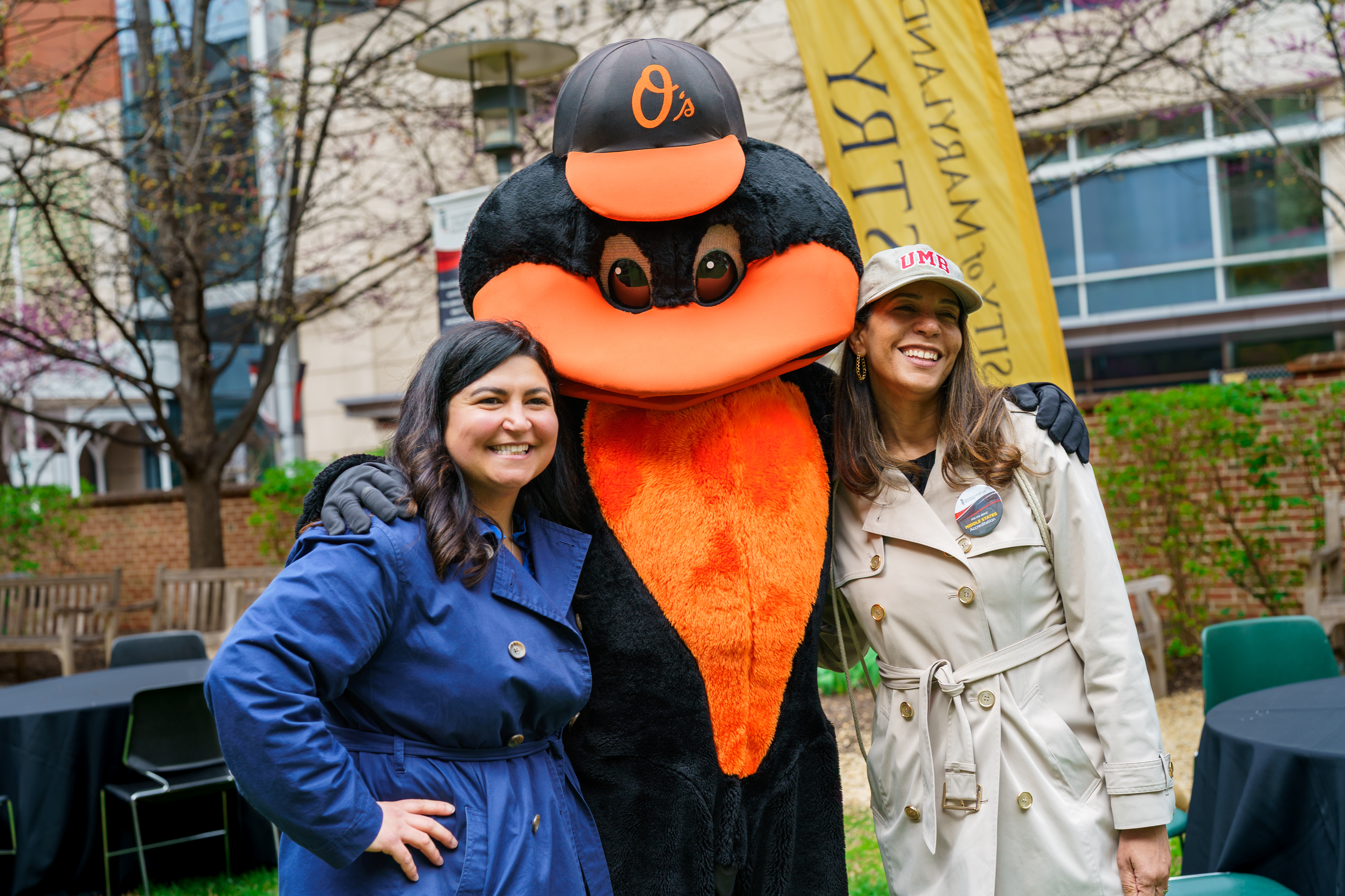 Oriole Mascot with two employees