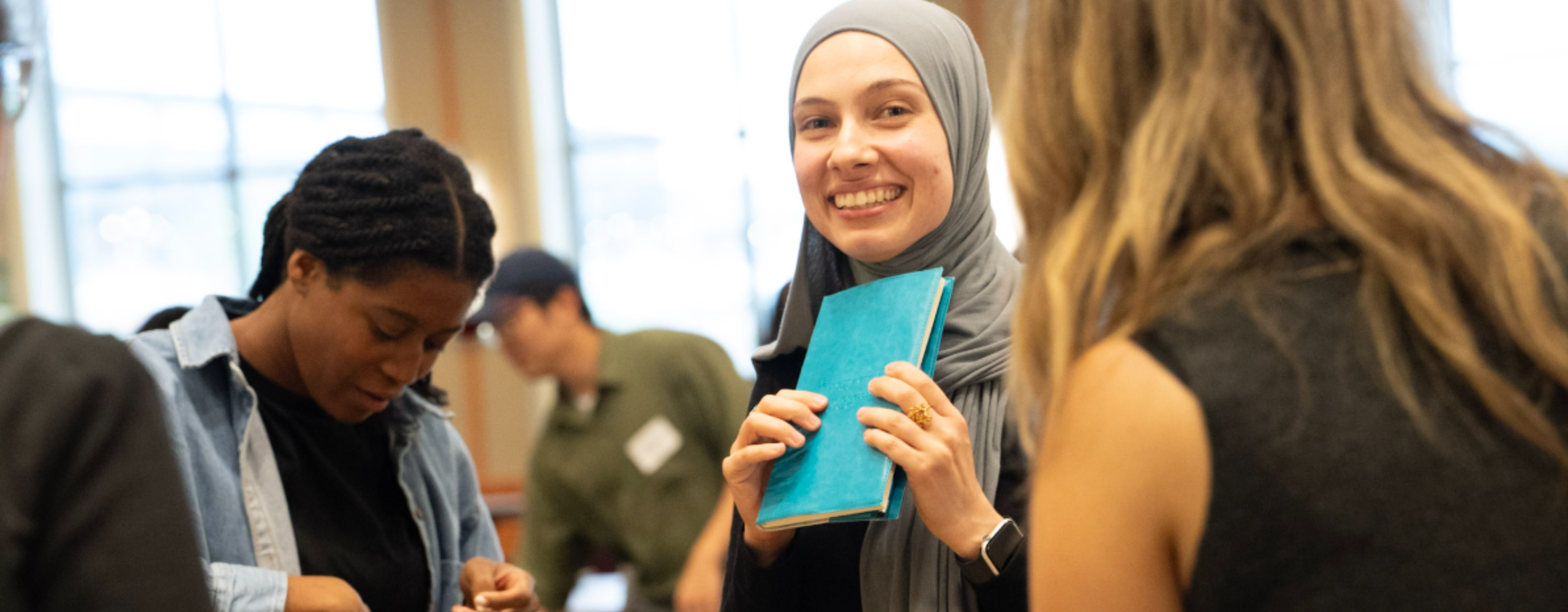 Woman smiling in group of people