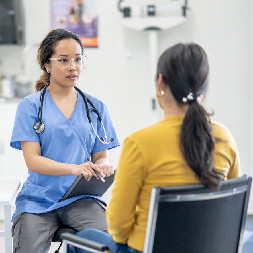 A doctor consults with a female patient