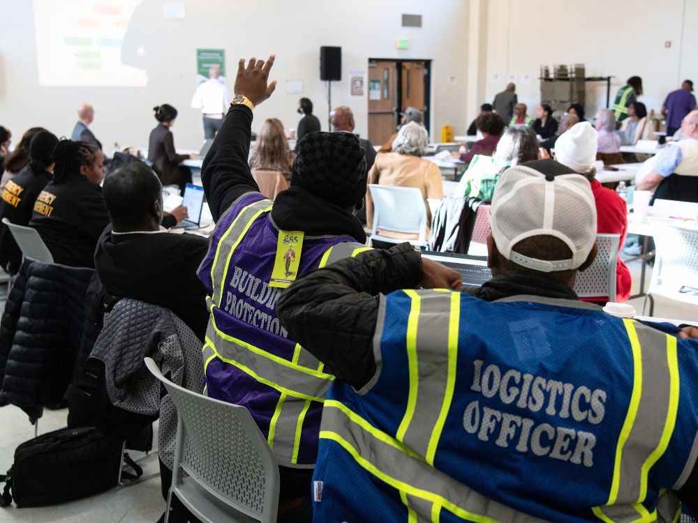 audience member raising hand at tabletop exercise