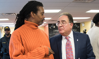 Community Engagement Center Advisory Board member Leslie Ware, representing Poe Homes, left, talks with President Jay Perman, MD, at the Community Engagement Center
