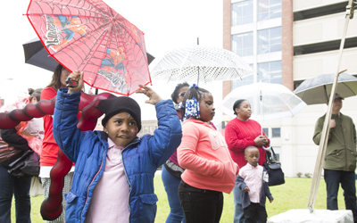 Community members withstood the rain to enjoy the Second Annual Neighborhood Festival on April 22, 2017.