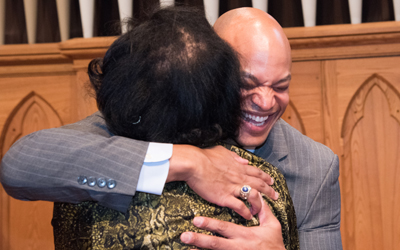 Wes Moore embraces audience member before core values speech on accountability
