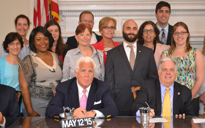 School of law and pharmacy faculty and students with MD Gov. Hogan.