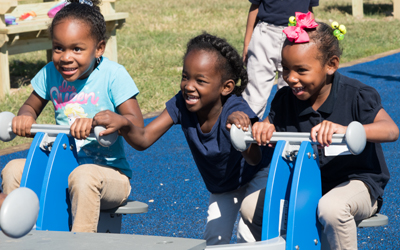 Harlem Park Elementary Middle School children play for the first time on the new equipment during recess on Sept. 22, 2016.