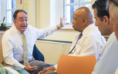 UMB President Jay A. Perman, MD, meets with Congressmen Elijah Cummings and John Sarbanes at a Baltimore City public school.