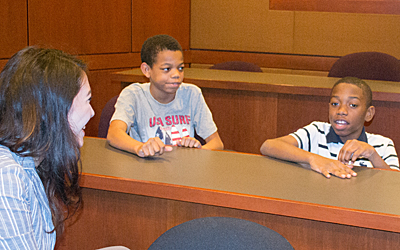 Youngsters from summer camp at Franklin Square Elementary/Middle School participate in a freedom of speech exercise at University of Maryland Francis King Carey School of Law in a partnership with UMB's Office of Community Engagement. 