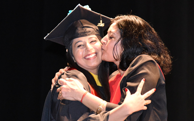 A University of Maryland School of Nursing graduate is congratulated by her mother.