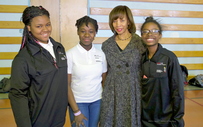 From left, Tyjahnae Morton, Shereen Farquharson, Baltimore Mayor Catherine E. Pugh, and Emani Clifton-Malone at the Maryland Science Olympiad-Baltimore Middle School STEM (Science Technology Engineering and Math) regional tournament. The students are UMB CURE Scholars.