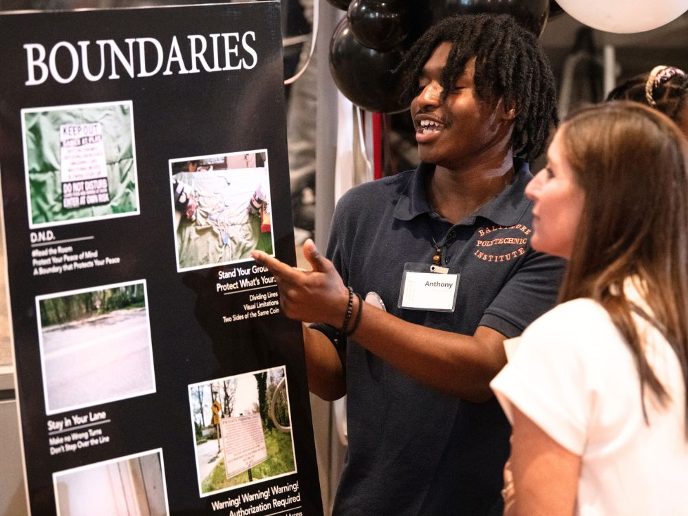 Baltimore Polytechnic Institute student Anthony Bonner explains his photos about boundaries.
