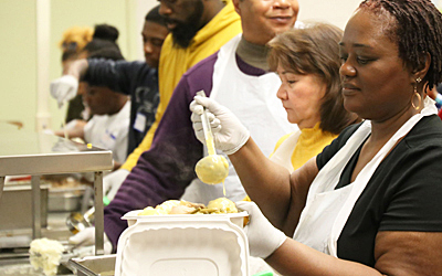 Project Feast volunteers serve diners on Thanksgiving Day 2019.
