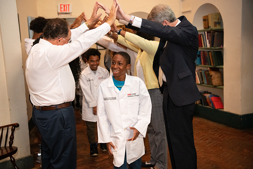 Student participating in the white coat ceremony