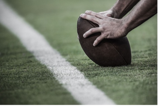 Football in "snap" position. Microsoft Word stock image.